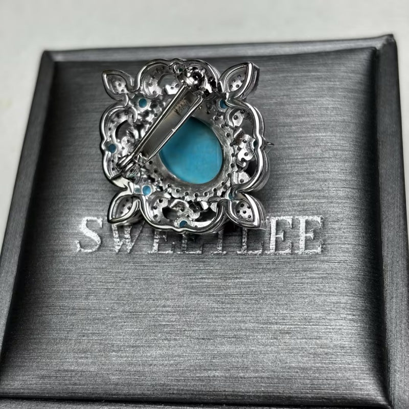 Oval Cabochon Turquoise & White Sapphire Floral Halo Brooch