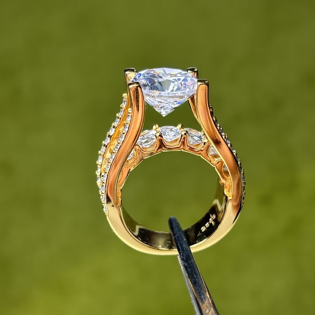 Round Brilliant Cut White Moissanite & Oval Accent Split Shank Ring